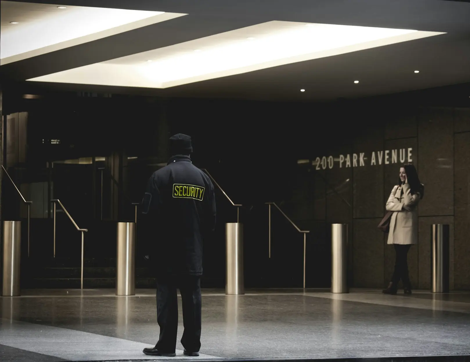 security guard standing on the gray floor